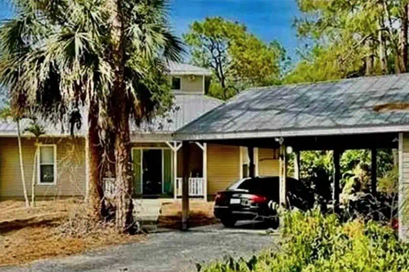 Front exterior view of the single-family home at 5281 Teak Wood Drive in Naples, Florida
