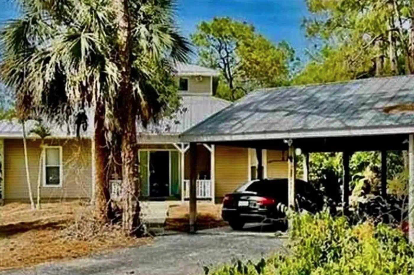 Front exterior view of the single-family home at 5281 Teak Wood Drive in Naples, Florida